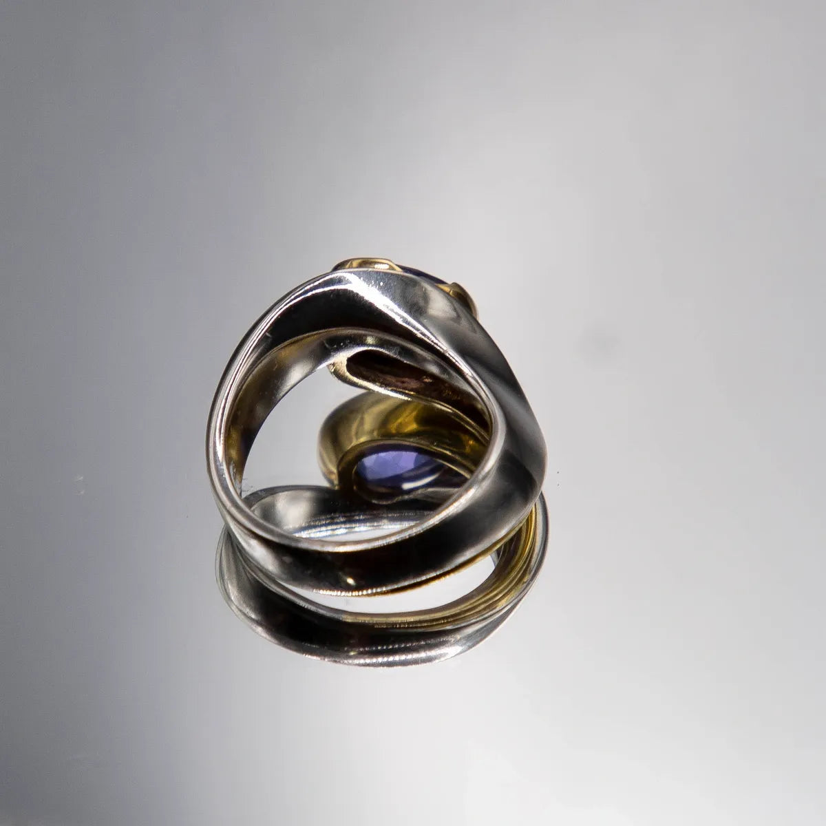 2.98 carat oval tanzanite in Platinum/18k yellow gold with 0.15ct. fine diamond
