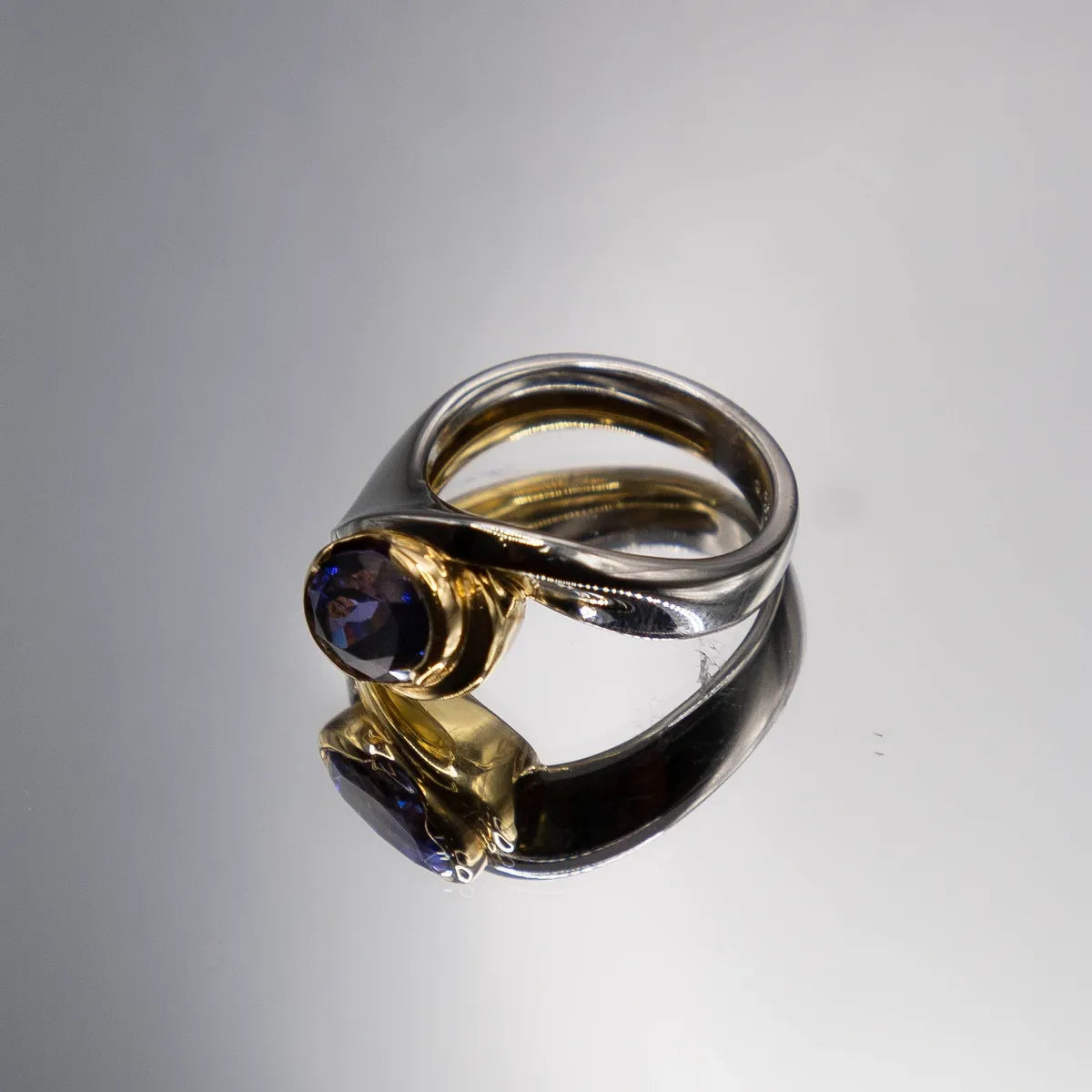 2.98 carat oval tanzanite in Platinum/18k yellow gold with 0.15ct. fine diamond