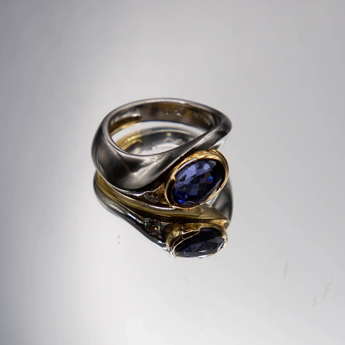 2.98 carat oval tanzanite in Platinum/18k yellow gold with 0.15ct. fine diamond