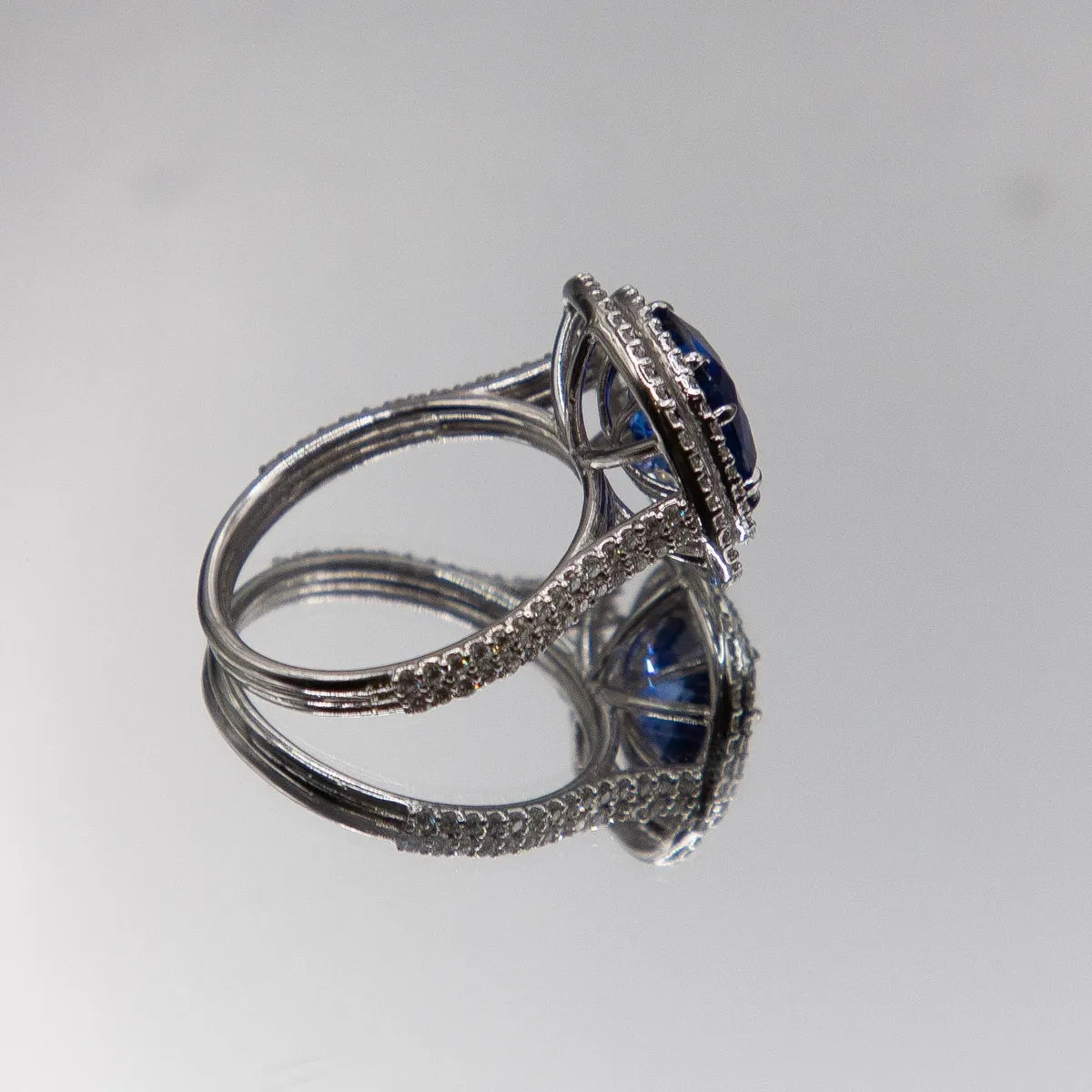 18k White Gold Halo/ Intense Blue Sapphire 6.39 Carats/ 132 Diamonds 0.66 Cts