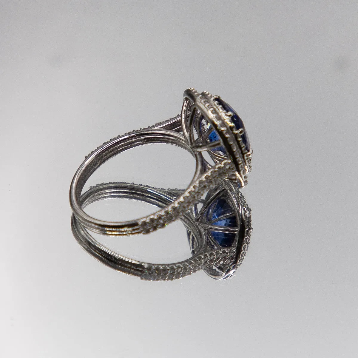 18k White Gold Halo/ Intense Blue Sapphire 6.39 Carats/ 132 Diamonds 0.66 Cts