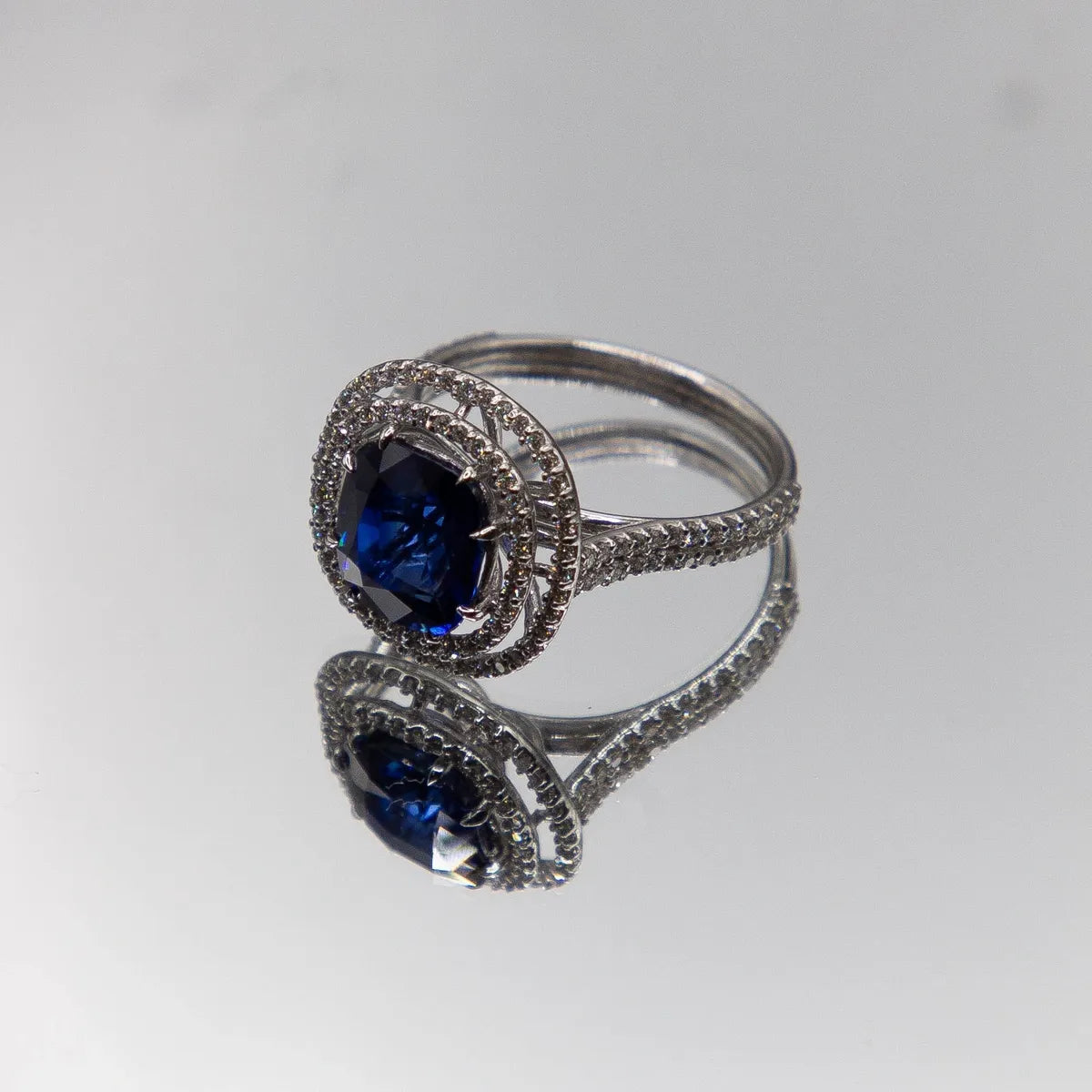18k White Gold Halo/ Intense Blue Sapphire 6.39 Carats/ 132 Diamonds 0.66 Cts