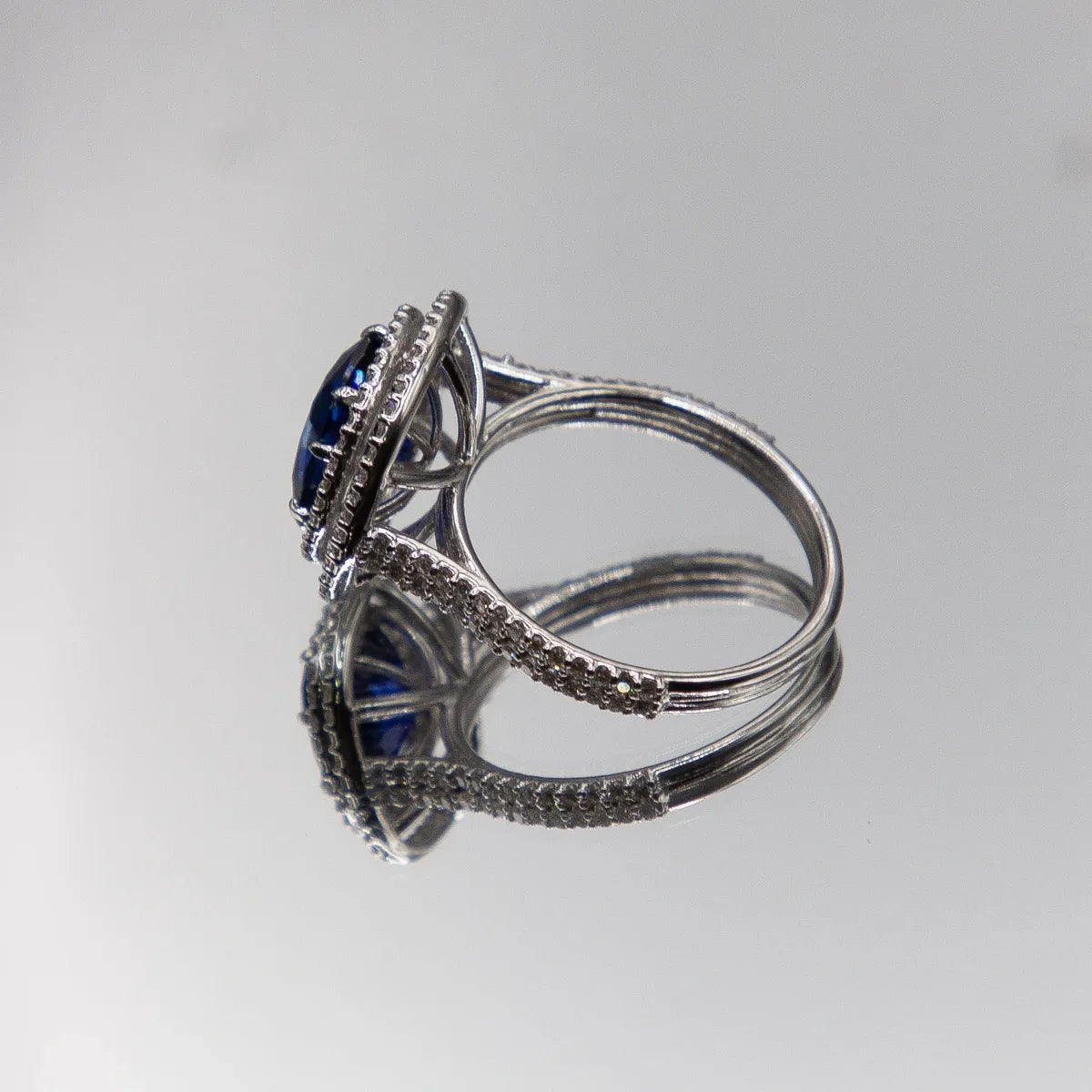 18k White Gold Halo/ Intense Blue Sapphire 6.39 Carats/ 132 Diamonds 0.66 Cts