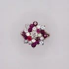 18k 2.50 carats ruby and 0.92 carats diamond pinwheel cluster. Florida estate.