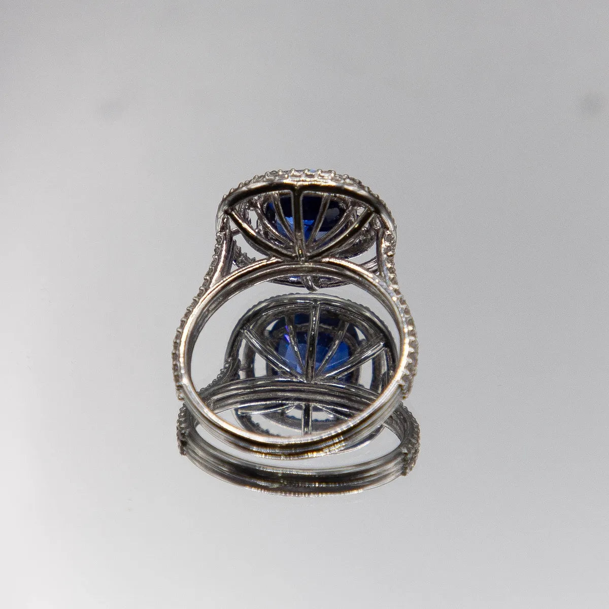 18k White Gold Halo/ Intense Blue Sapphire 6.39 Carats/ 132 Diamonds 0.66 Cts