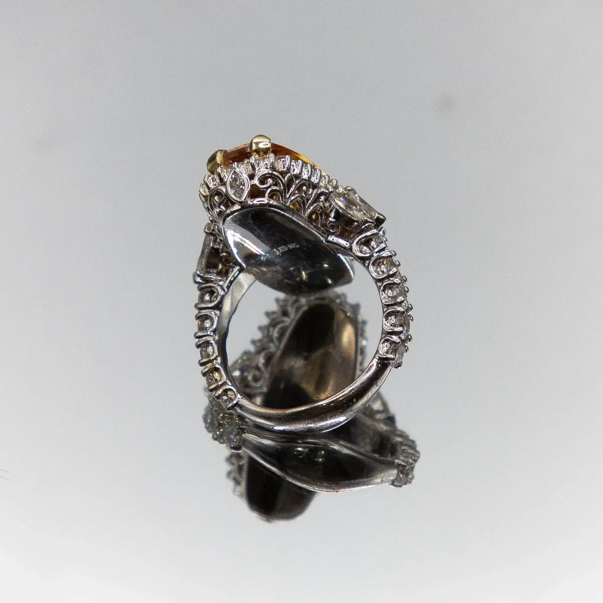 10.20 Imperial Topaz Idar Oberstein-cut Cognac color 3.64cts. 18k Diamond Ring